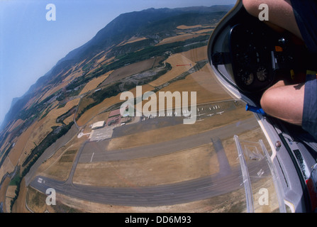 Aerial view of glider plane Twin Astir flying over aerodrome of Santa Cilia de Jaca, Aragon, Spain Stock Photo