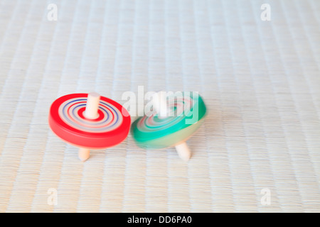 Spinning tops on tatami mat Stock Photo