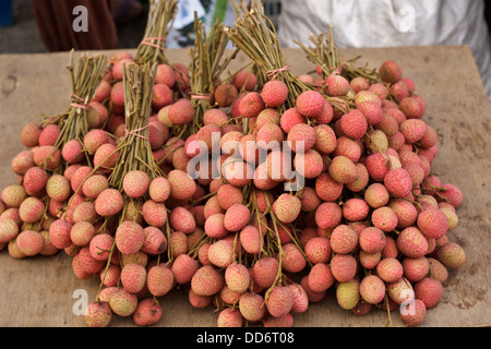 Red lychee bunch sell in market, Thailand. Stock Photo