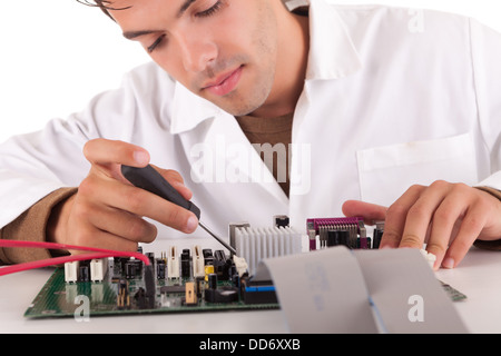 Happy and successful young computer engineer Stock Photo