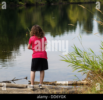 Pre-teen Girl Portrait with Fish Rod, Female Fisherman Catching