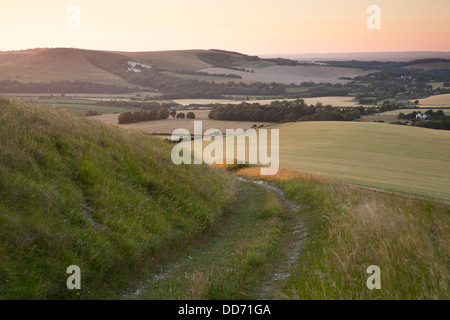 The view down Firle Beacon to Mount Caburn and Glynde in the South Downs National Park Stock Photo