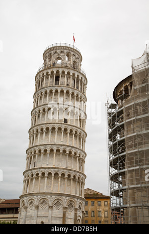 Leaning Tower in Pisa, Italy with new construction nearby Stock Photo