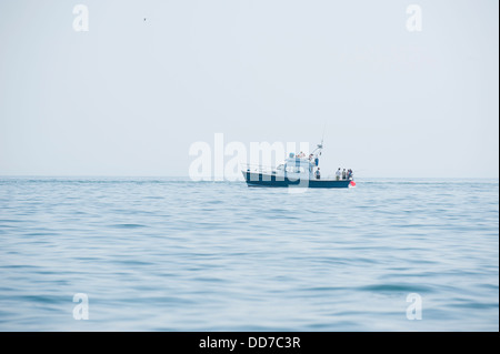 Small leisure fishing boat off the coast of South Wales, United Kingdom Stock Photo