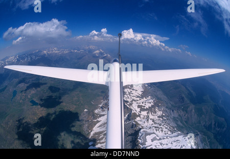 Glider plane Twin Astir flying over Pena Retona mountains, Aragon, Spain Stock Photo