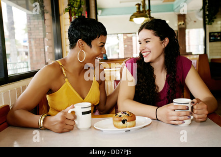 Women having coffee together in restaurant Stock Photo