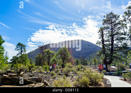 Tourists on the Lava Flow Trail at Sunset Crater Volcano National Monument, near Flagstaff, Arizona, USA Stock Photo