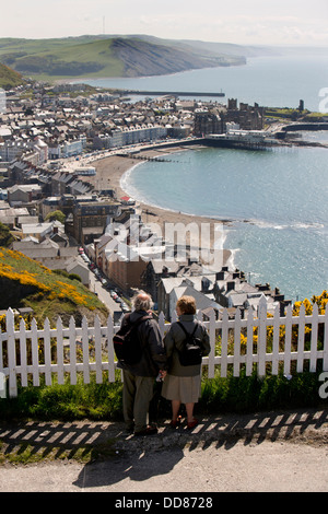 UK, Wales, Ceredigion, Aberystwyth, couple looking down onto town from Constitution Hill Stock Photo