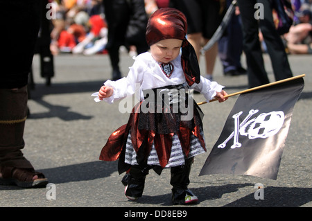 Adorable baby in pirate costume on wooden background. Halloween concept  Stock Photo - Alamy