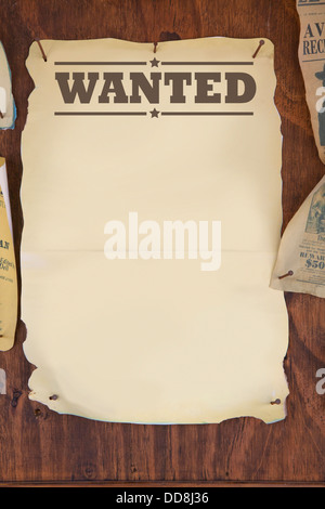 wanted notice paper on old wooden background Stock Photo