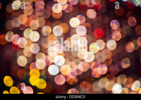 abstract pink, red and yellow oval shaped highlights which are out of focus backlit glass spheres Stock Photo