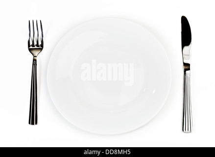 Plate with silverware: knife and fork, over white Stock Photo