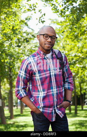 Black man smiling in park Stock Photo