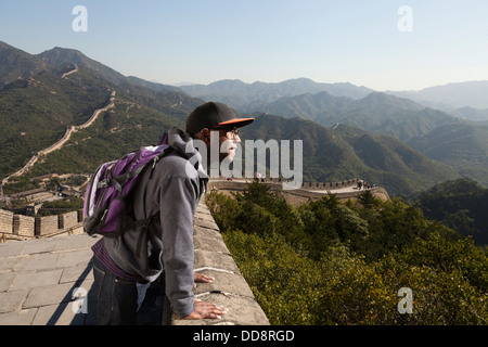 Black man standing on Great Wall of China, Beijing, Beijing, China Stock Photo