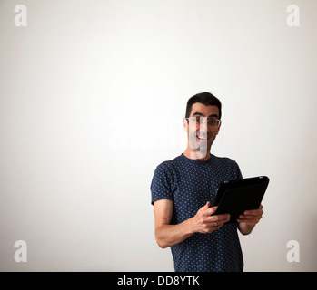 Excited man with Ipad Tablet Stock Photo