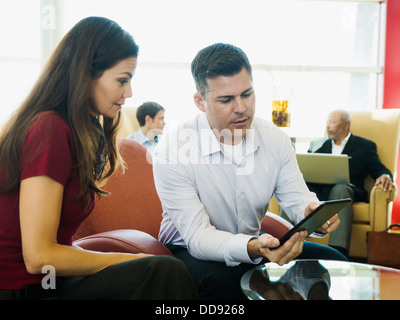 Business people using digital tablet Stock Photo