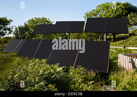 Small Solar farm in a rural countryside setting used to pump water for commercial agricultural use Stock Photo