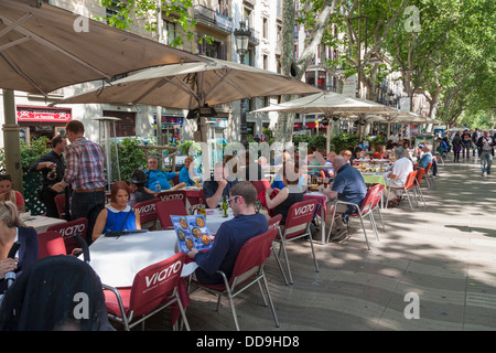 customers in street cafe in La Rambla Barcelona Stock Photo