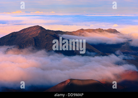 Sunset above the clouds over 3000 meters at the Haleakala Volcano, Maui, Hawaii Stock Photo