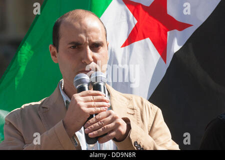London, UK. 29th Aug, 2013.  An activist addresses the gathering at a protest outside parliament by UK-based Syrians demanding action against the Assad regime for chemical weapons attacks aginst civilians. Credit:  Paul Davey/Alamy Live News