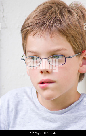 Portrait of a boy looking away Stock Photo - Alamy