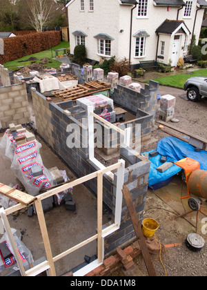 self building house, constructing ground floor, with insulated cavity closers in door and window openings Stock Photo