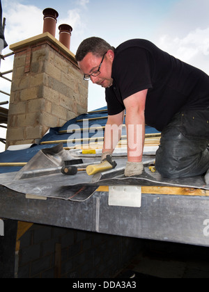 Al809 self building house, constructing dormer roof, specialist lead worker forming traditional sheet roofing lead Stock Photo