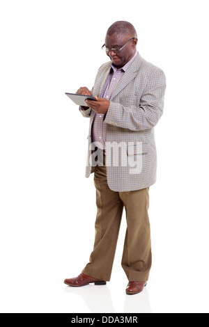 modern African American old man using tablet computer on white background Stock Photo