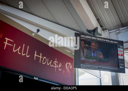 London, UK. 29th Aug, 2013 - Seen on a TV screen inside the Moto Services on the M4 motorway, near Heathrow airport, London England, Conservative MP, Dr Liam Fox speaks in favour of military action against the Assad government in Syria during an emergency debate in the House of Commons, the parliament of the United Kingdom, a pun on the term Full House - Copyright Richard Baker / Alamy Live News.