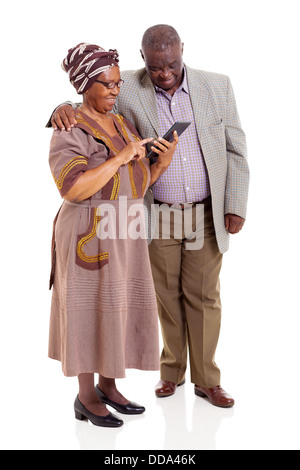 happy senior African couple using tablet computer on white background Stock Photo
