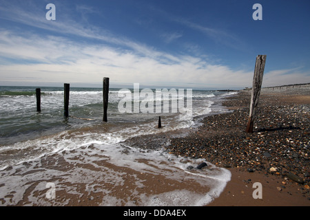 The tide, the beach and coastal defenses on a windy day at Tywyn, Mid Wales. Stock Photo