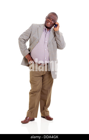 elderly African man talking on mobile phone isolated on white Stock Photo