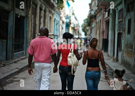 A family walking together in Old Havana. Stock Photo