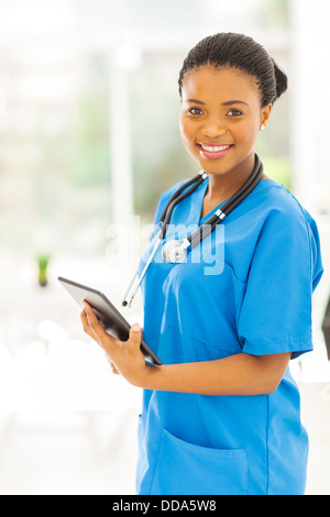 pretty African American medical worker with tablet computer Stock Photo