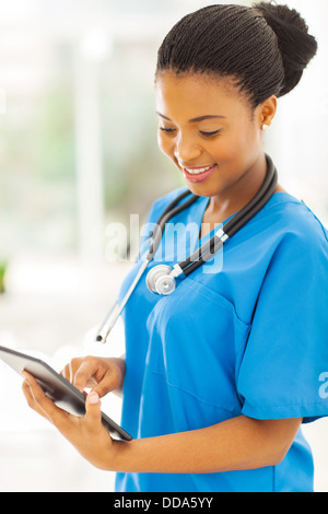 pretty afro American nurse using tablet pc Stock Photo