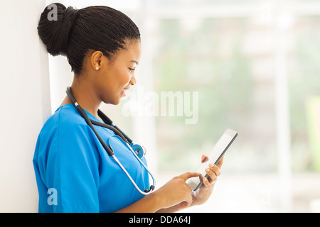 young happy African American medical worker using tablet computer Stock Photo
