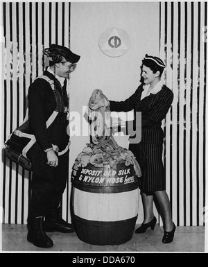 The worn out nylon stockings in this barrel full of salvaged stockings will be reprocessed and made into parachutes... - - 196427 Stock Photo