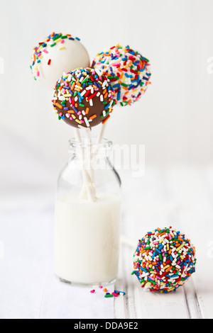 Chocolate covered cake pops decorated with colorful sprinkles Stock Photo