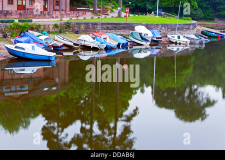 Boats moored on the banks of Rudyard Lake in the Peak District in late evening Stock Photo