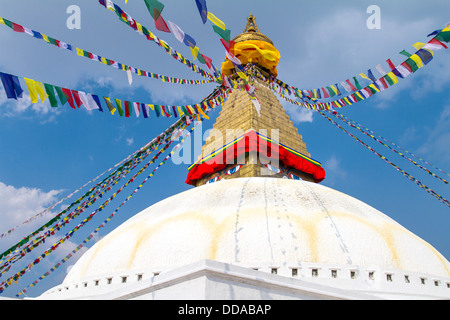 Buddhist shrine Boudhanath Stupa with Buddha wisdom eyes and praying flags in Kathmandu, Nepal Stock Photo