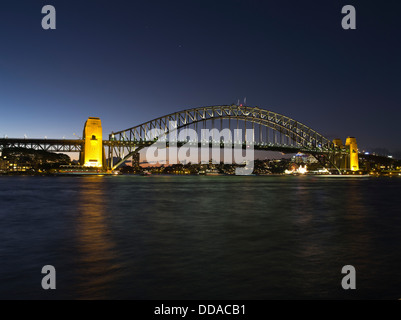 dh Sydney Harbour SYDNEY AUSTRALIA Floodlit Sydney Harbour Bridge evening sunset night Stock Photo