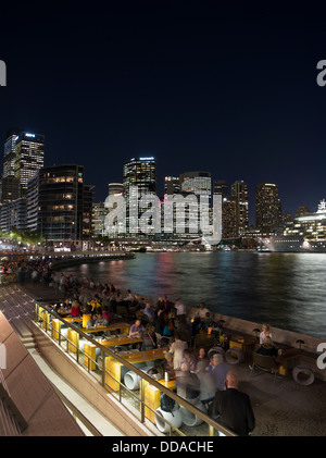 dh Sydney Harbour restaurants SYDNEY AUSTRALIA Cafe people evening alfresco cafe city waterfront skyline night view promenade Stock Photo