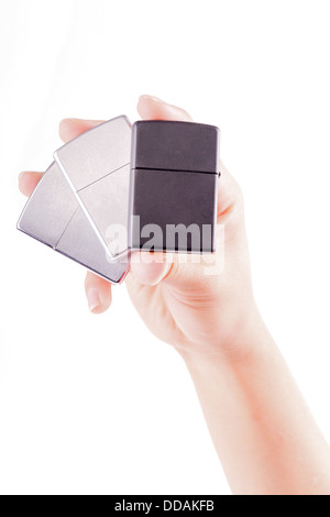 hand holding metal lighters isolated on white background Stock Photo