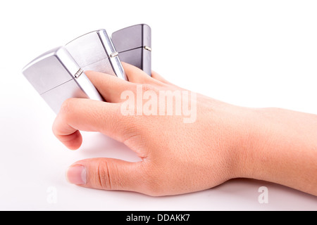 hand holding metal lighters isolated on white background Stock Photo