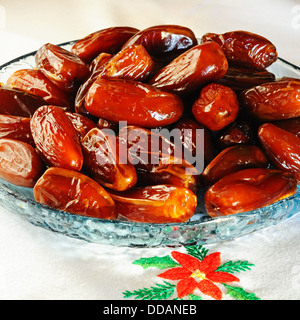 Dates in a shallow glass dish, England, UK, Western Europe. Stock Photo