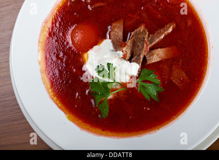 ukrainian and russian red-beet soup (borscht) with garlic and sour cream Stock Photo