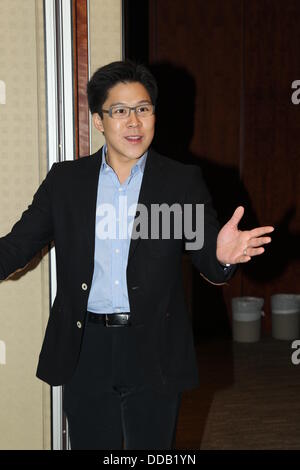 Kenneth Fok holds press conference to show off new baby to media in Hong Kong,China on Thursday August 29,2013.Retired Olympic diving champion Guo gave birth to her first baby with Kenneth Fok,the eldest son of tycoon Timothy Fok,in Hong Kong on Tuesday.'Jingjing and the baby,weighing 3.3 kilograms,are safe and sound,' Kenneth blogged on Sina Weibo at 12:24 on Tuesday,adding his gratitude to medical workers,relatives and friends.He also expressed the joy of the whole Fok family at the baby's birth. Stock Photo