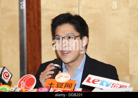 Kenneth Fok holds press conference to show off new baby to media in Hong Kong,China on Thursday August 29,2013.Retired Olympic diving champion Guo gave birth to her first baby with Kenneth Fok,the eldest son of tycoon Timothy Fok,in Hong Kong on Tuesday.'Jingjing and the baby,weighing 3.3 kilograms,are safe and sound,' Kenneth blogged on Sina Weibo at 12:24 on Tuesday,adding his gratitude to medical workers,relatives and friends.He also expressed the joy of the whole Fok family at the baby's birth. Stock Photo