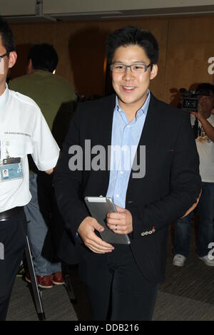 Kenneth Fok holds press conference to show off new baby to media in Hong Kong,China on Thursday August 29,2013.Retired Olympic diving champion Guo gave birth to her first baby with Kenneth Fok,the eldest son of tycoon Timothy Fok,in Hong Kong on Tuesday.'Jingjing and the baby,weighing 3.3 kilograms,are safe and sound,' Kenneth blogged on Sina Weibo at 12:24 on Tuesday,adding his gratitude to medical workers,relatives and friends.He also expressed the joy of the whole Fok family at the baby's birth. Stock Photo