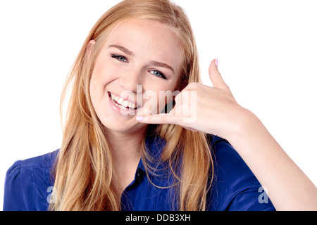 Beautiful girl making a Call Me sign with her fingers as an invitation for a friend to contact her by telephone, isolated on white Stock Photo